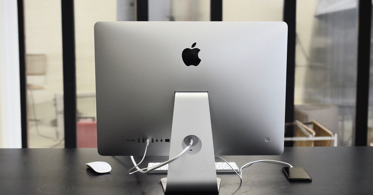 Contemporary convenient computer on table with mobile phone in office of business center