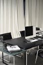 Black and white of contemporary computer placed on table in simple contemporary workplace of office