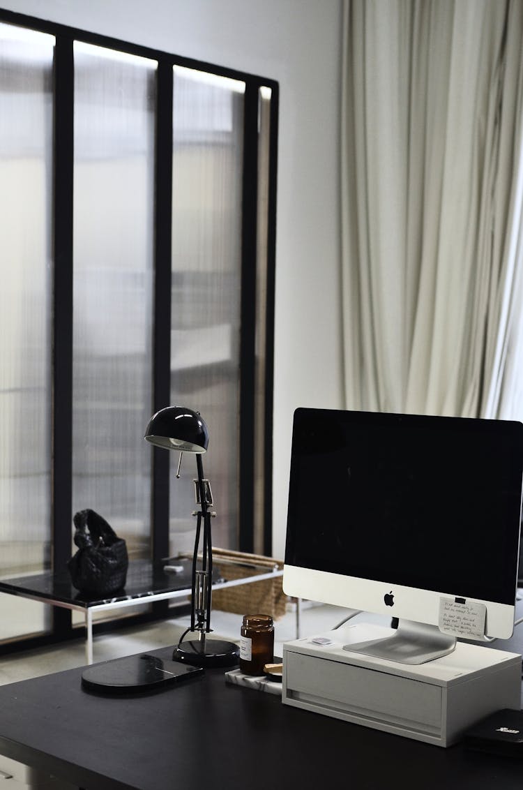 Contemporary Computer On Table In Modern Workspace Of Office