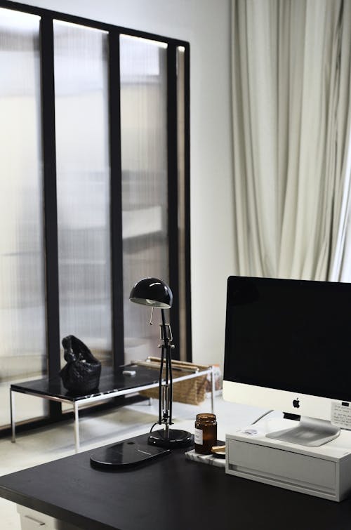 Contemporary computer placed on table in office