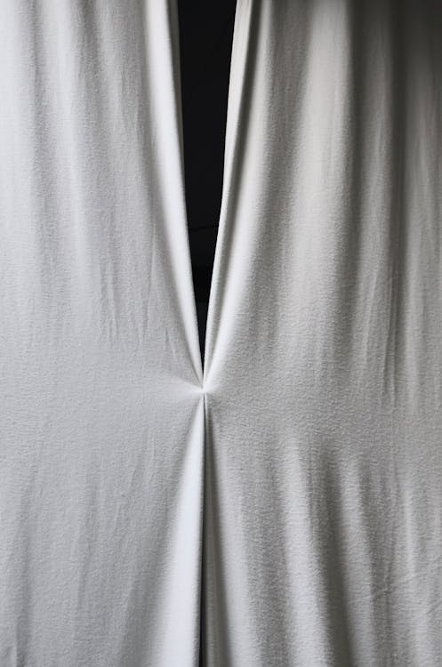 Black and white of attached textile of soft simple crumpled curtains with creases