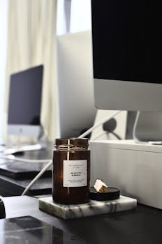 Contemporary office setup with a fragrant candle providing a calm, aromatic ambiance.