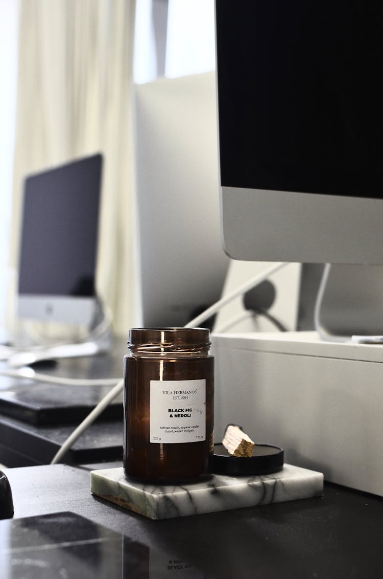 Jar With Aromatic Candle On Marble Surface On Table