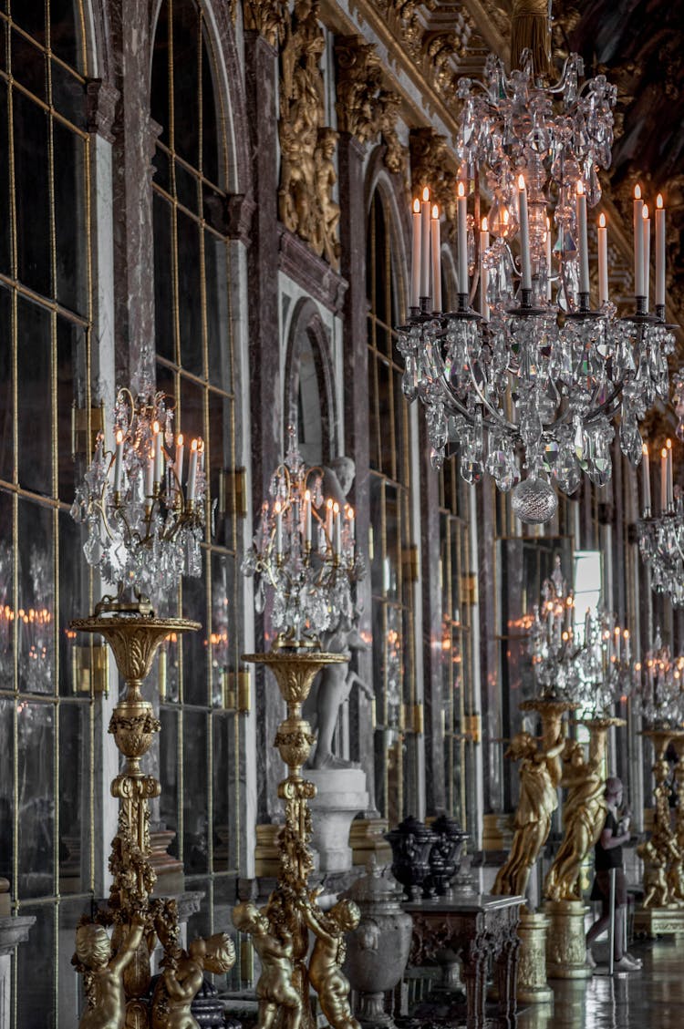 Photo Of Candelabras And Chandeliers Inside A Palace