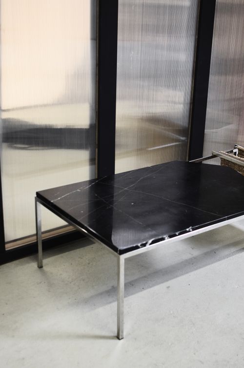 Free Old rectangular shaped metal table on floor with shadow near glass wall in house room Stock Photo