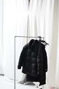 Ordered black wool coat — photo by Skylar Kang on Pexels