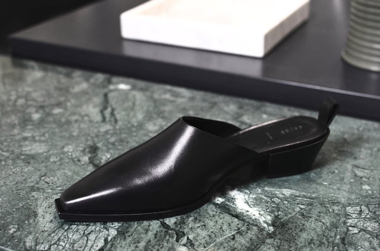 Stylish Shiny Shoe On Marble Surface