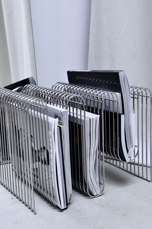 Magazines On Rack Rack with various magazines on floor · Free Stock Photo