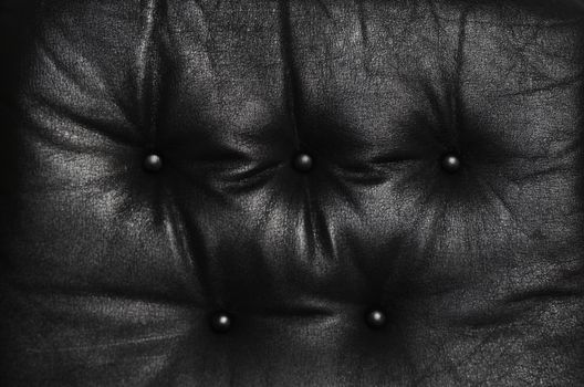 Cushion of black leather weathered sofa