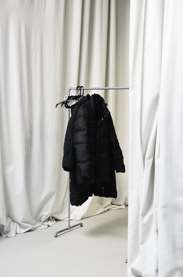 Stylish Jackets On Rack In Room