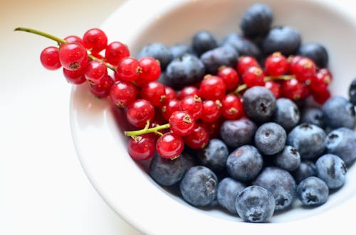 Heap of fresh berries on table