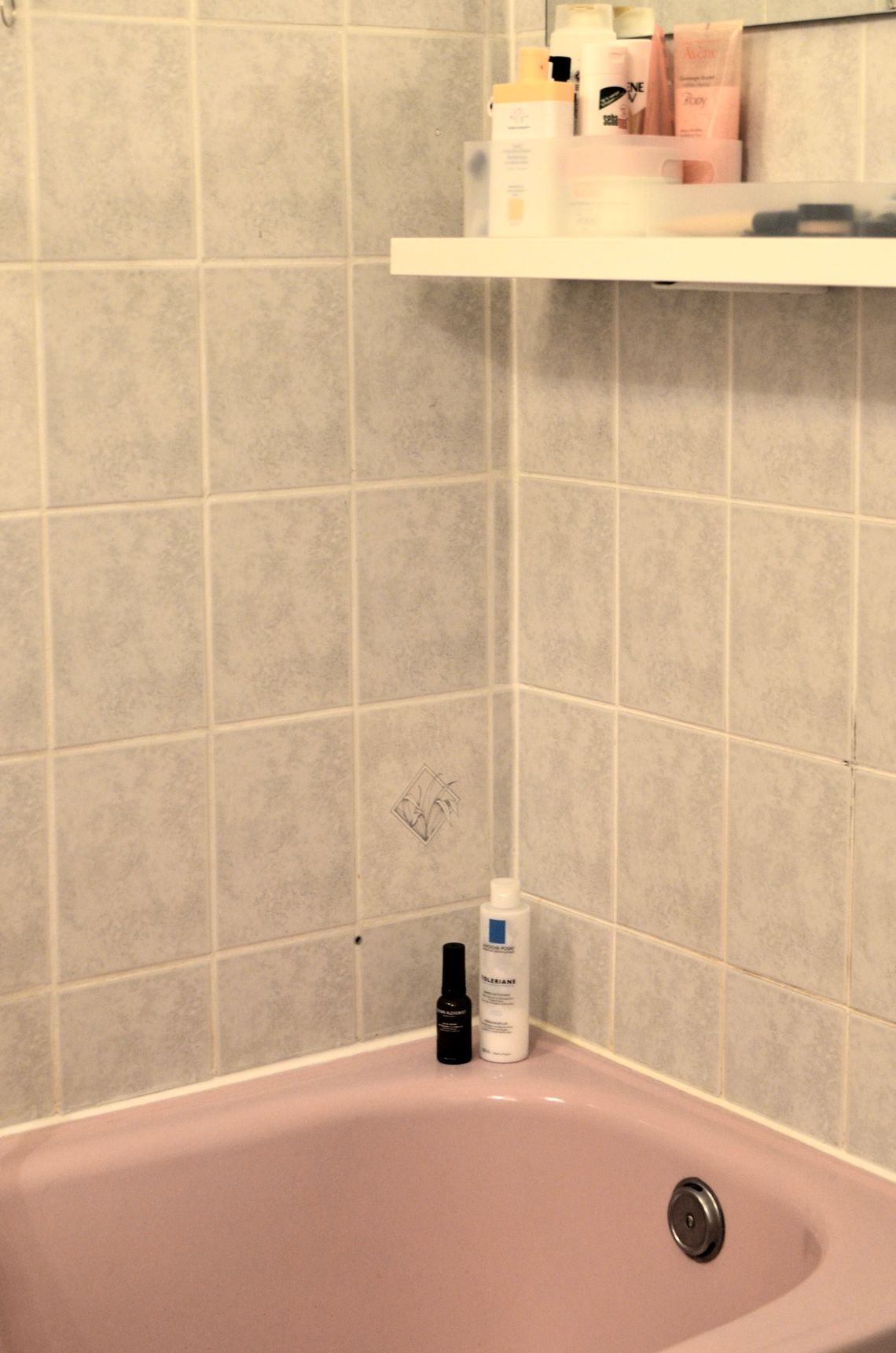 Bath, skincare, and hygiene products arranged in a modern bathroom