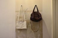Bag hanging on shabby wall