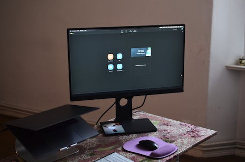 Modern computer with laptop on table