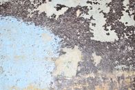 Old shabby wall with cracked paint