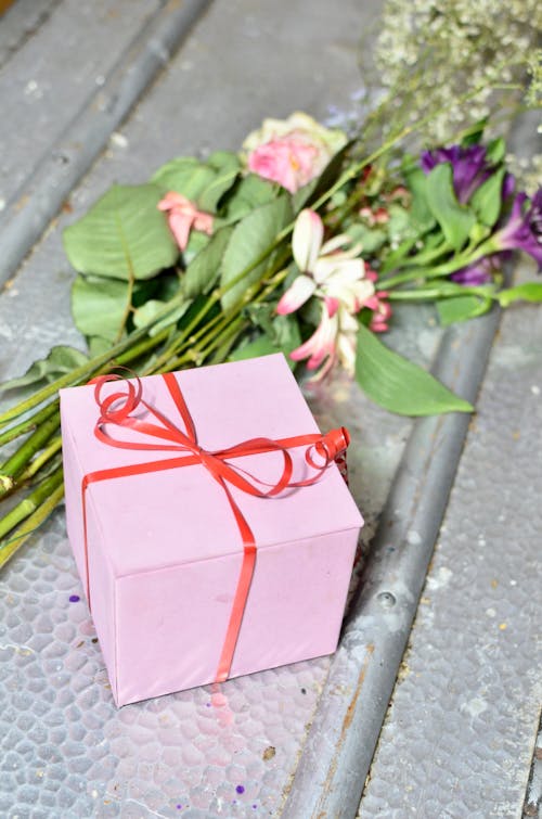 Gift box with bouquet of flowers