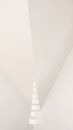 Geometric white round shaped object near wall