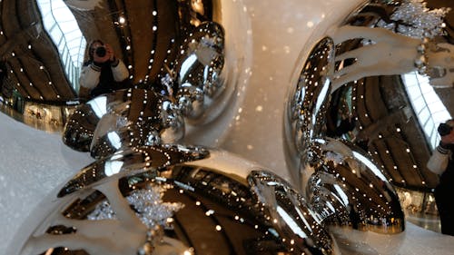 Sparkling shiny silver baubles with reflection