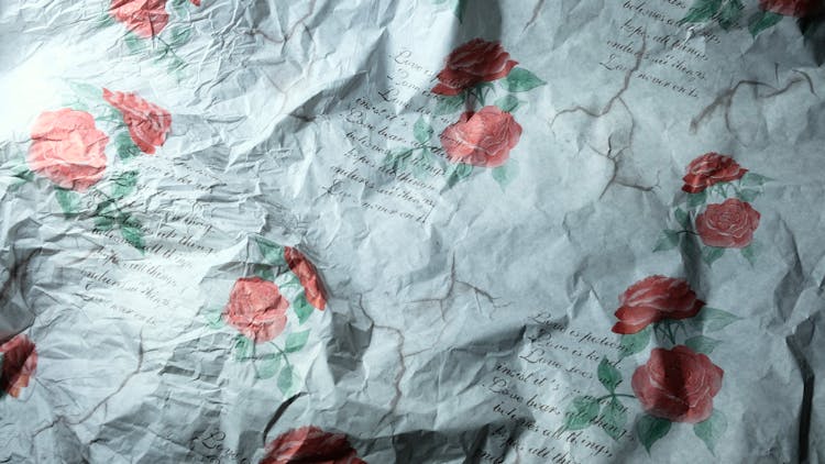 Crumpled Paper With Pattern Of Roses