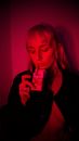 Thoughtful woman with closed eyes taking out cigarette
