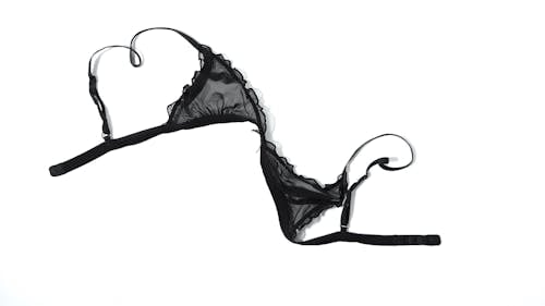 Free Single top bra piece of feminine lace black lingerie isolated on white background Stock Photo