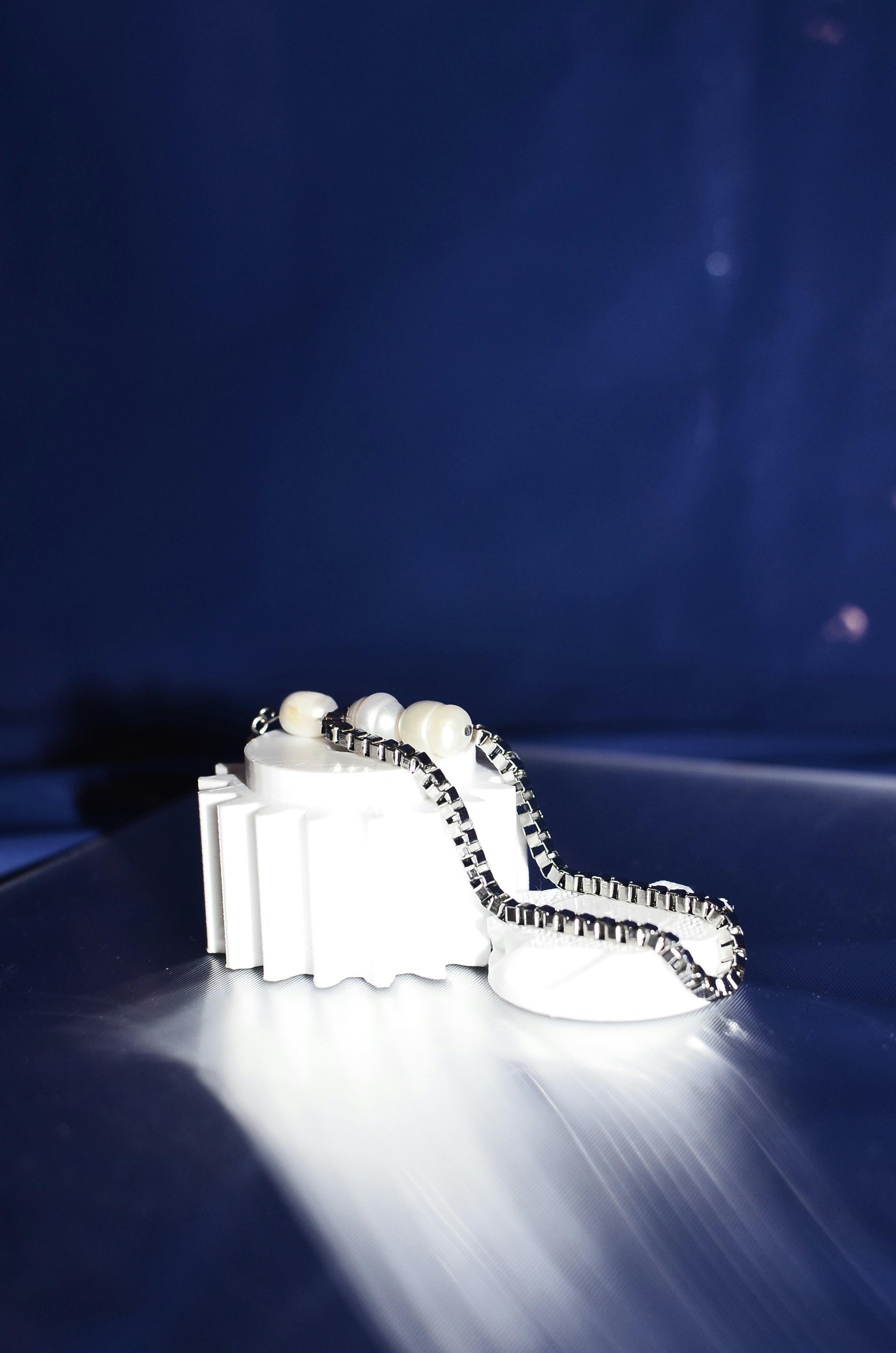 crystal earring on white detail on table