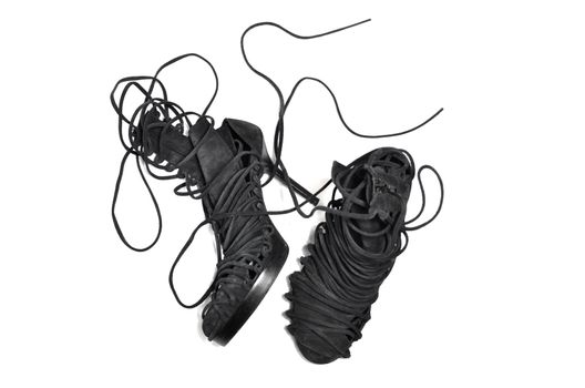 Modern stylish pair of shoes with long lacing