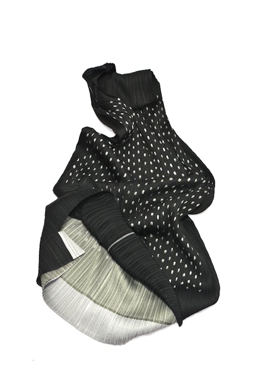 Crumpled black scarf with white spots and light linen