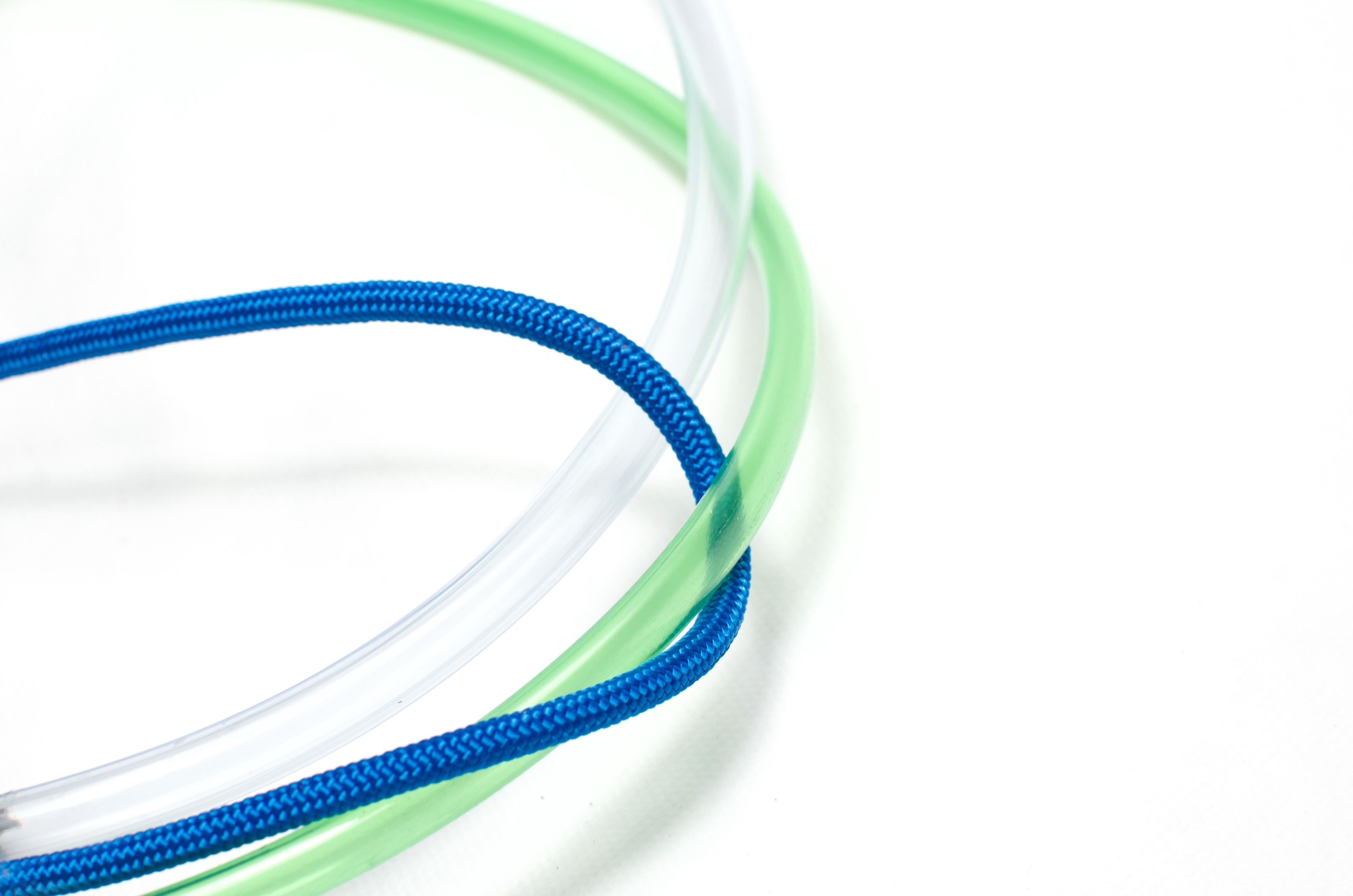 Cable rope threaded between transparent plastic tubes · Free Stock Photo