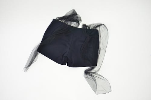 Stylish shorts with silk belts in studio