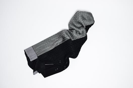 Fashionable skirt with stitched stripes and holes on white background in modern studio