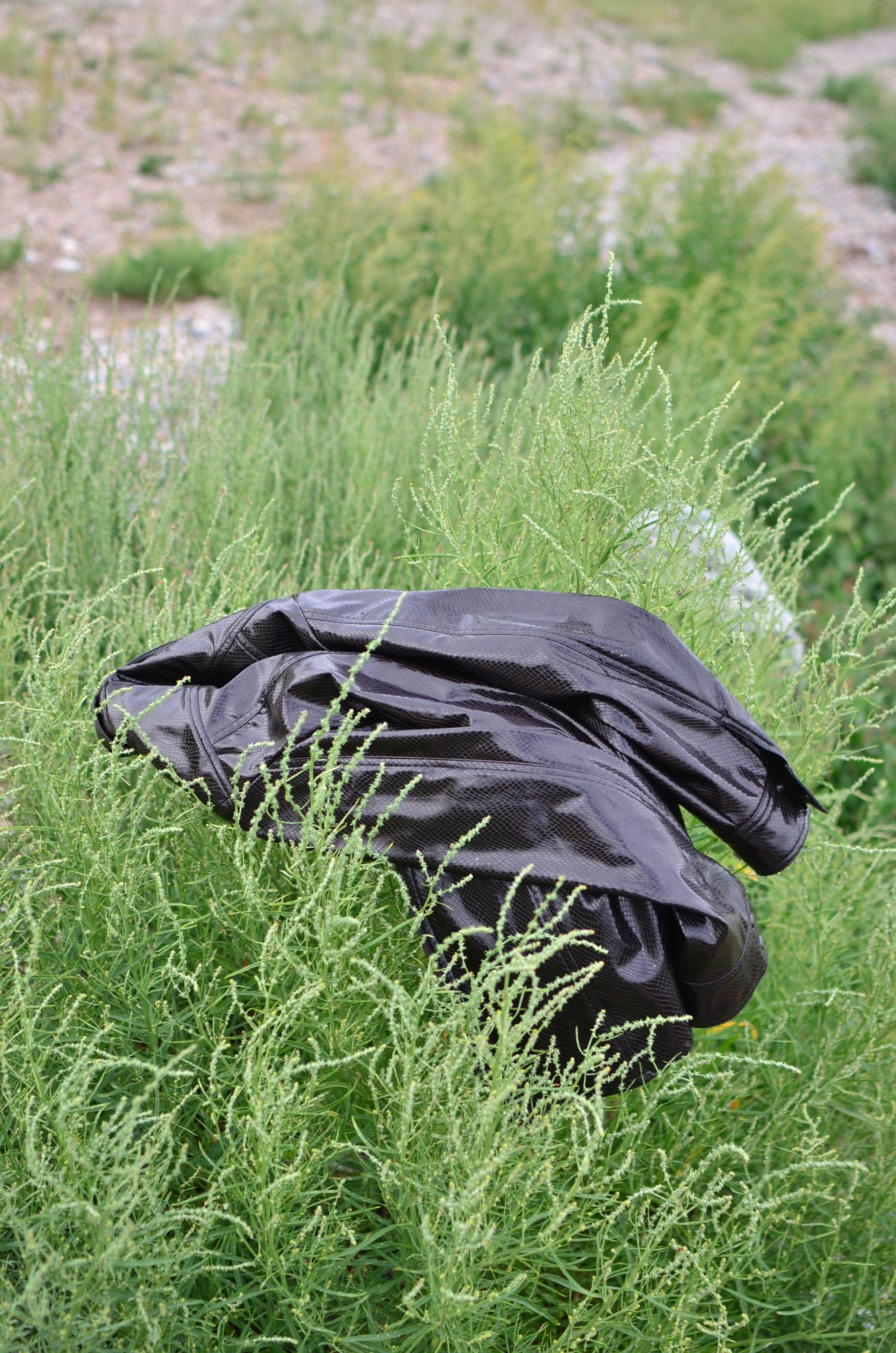 latex jacket on high lush grass