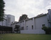 Modern building with tables on yard