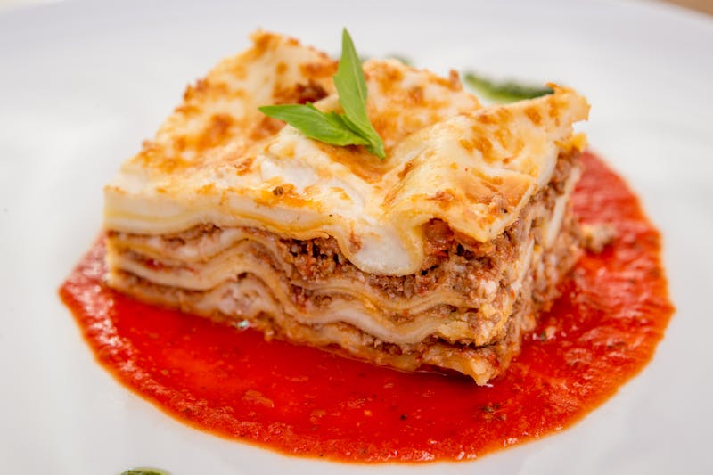 Classic lasagna slice on a white plate