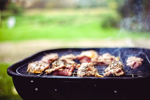 Free Meat Grilled on Charcoal Grill Stock Photo