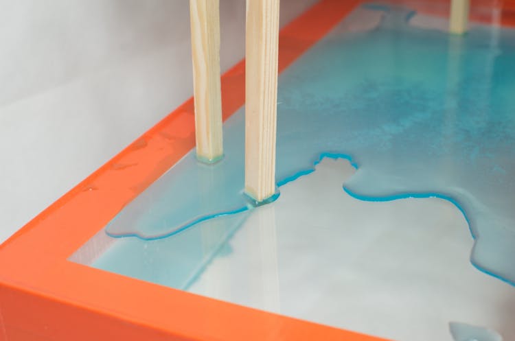 Wooden Planks On Glass Table With Spilled Water