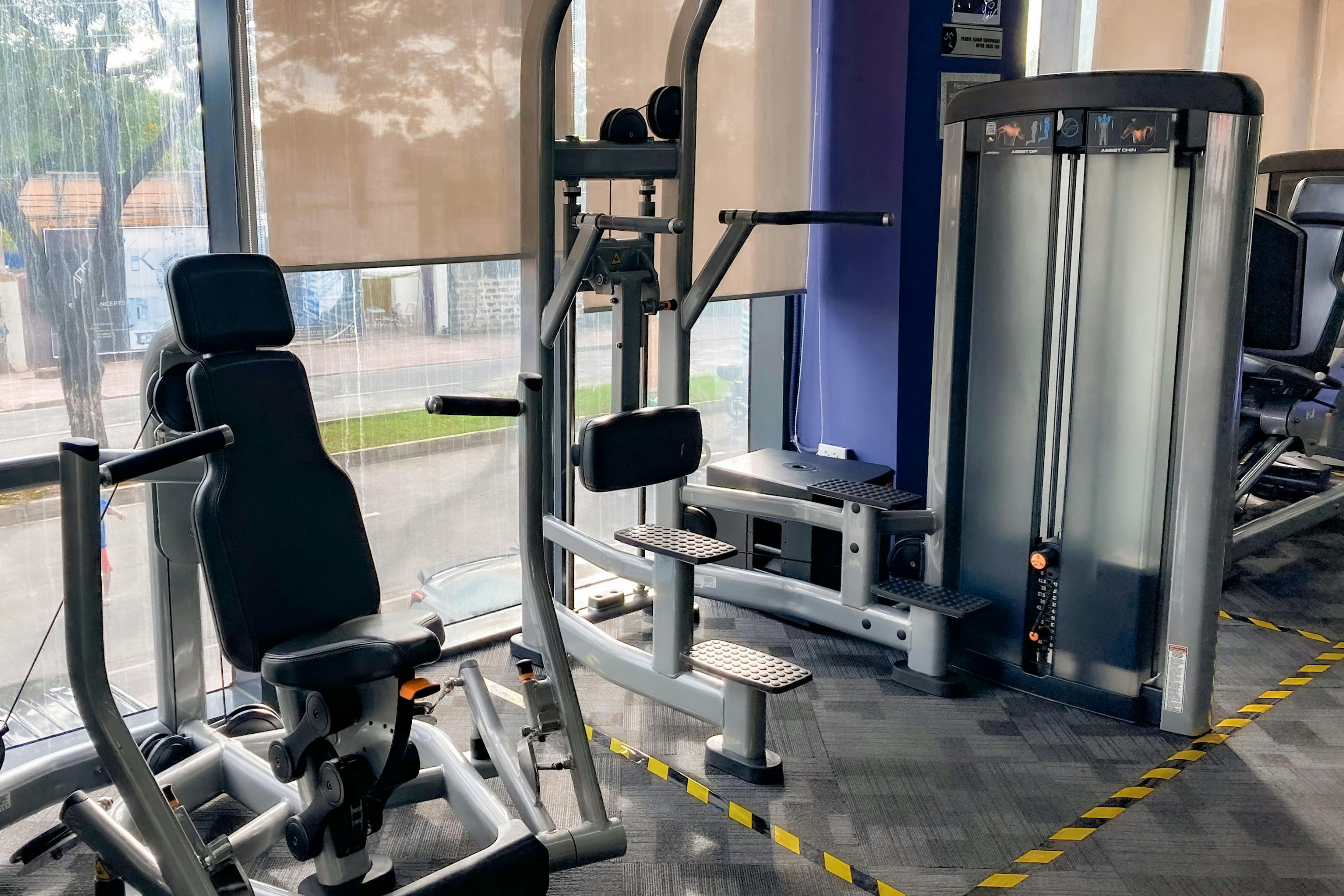 High-quality gym equipment set in a bright, indoor fitness center.