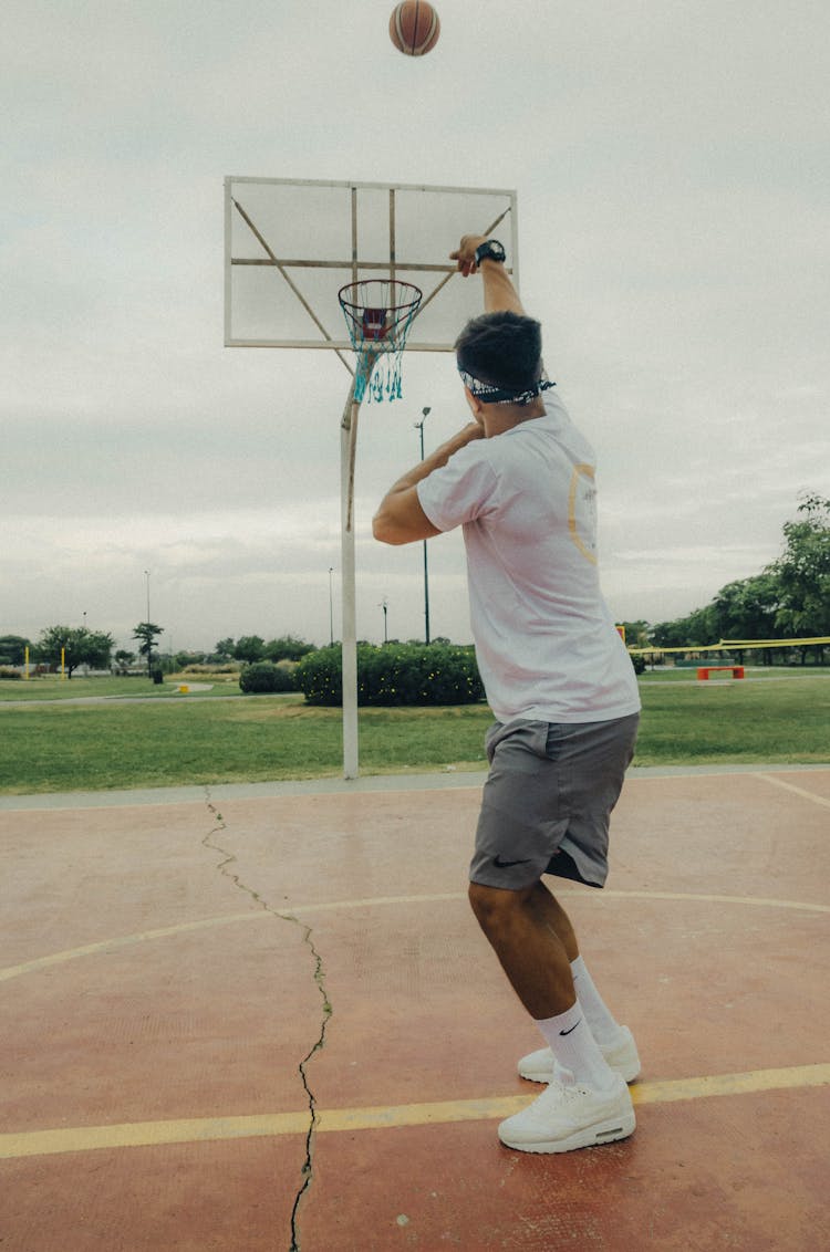 Man In White T-shirt Playing Basketball