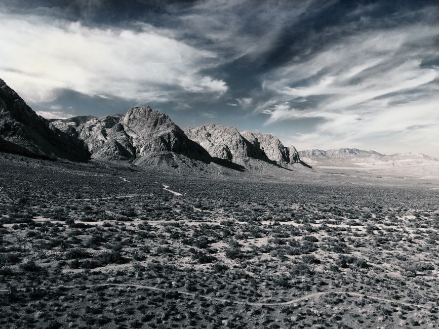 Unbeatable Las Vegas Strip Helicopter Night Flight Review: The Ultimate Way to See Sin City Sparkle Review 2026 - Majestic view of Red Rock Canyon's rugged mountains under a dramatic sky.