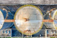 Top view of huge industrial tanks at factory facility