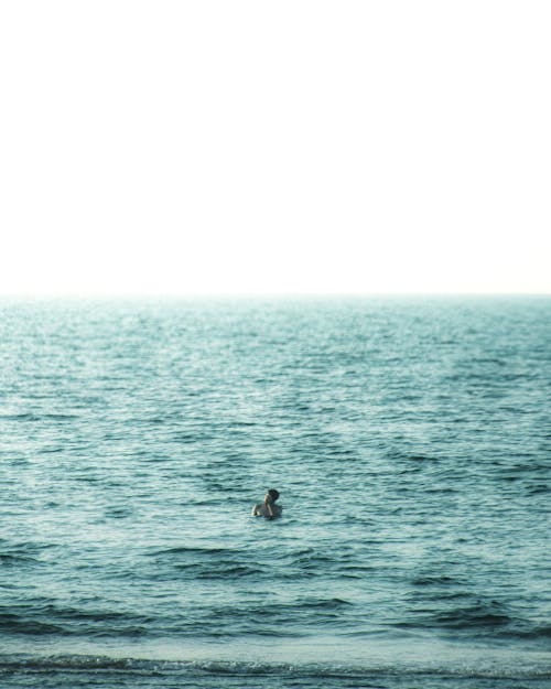 Free Person Swimming in the Ocean Stock Photo