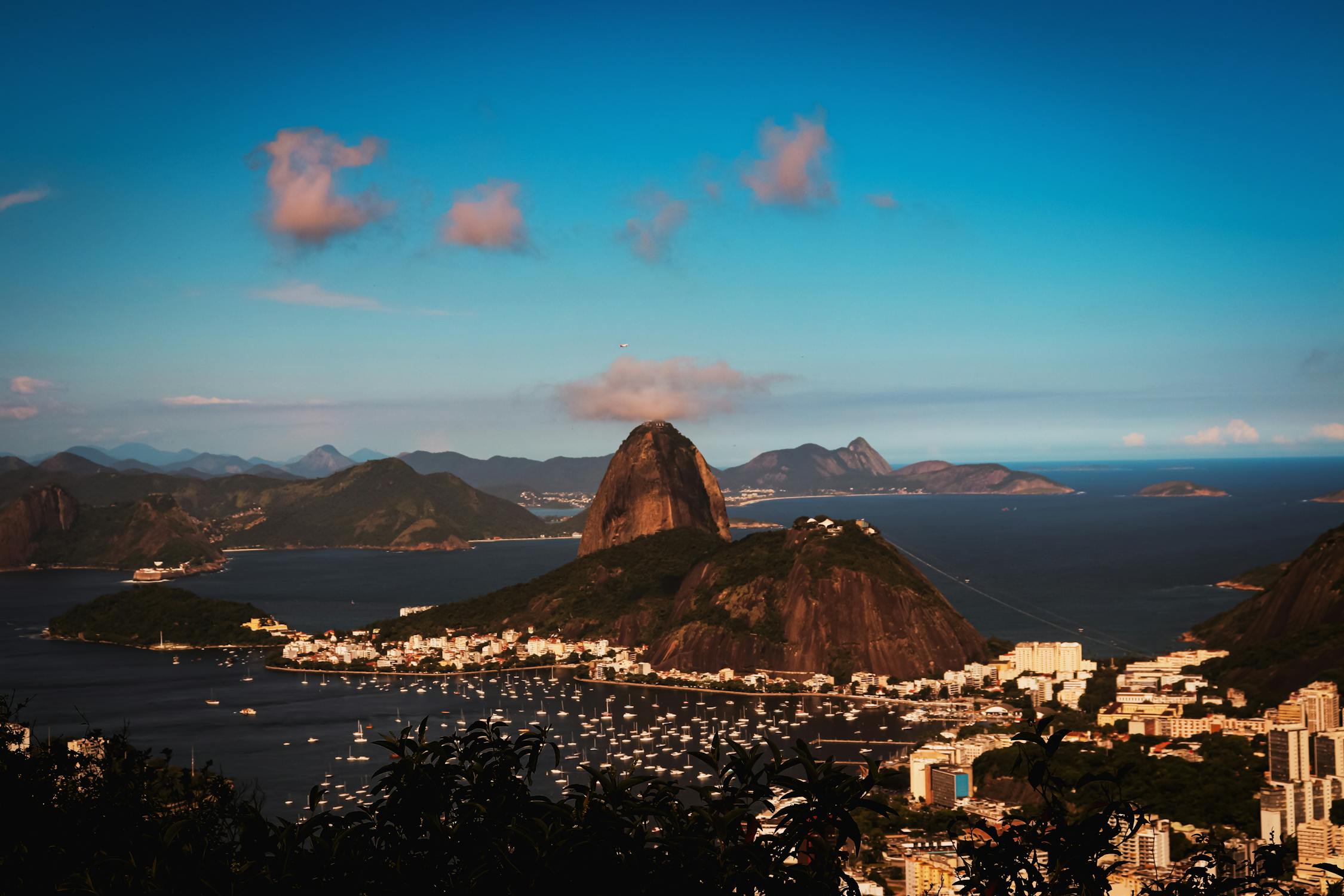 Brown Mountain Surrounded with White Buildings