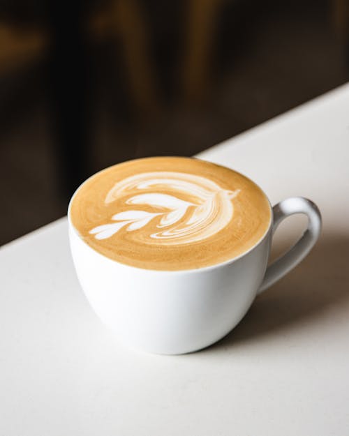 Coffee Latte on White Ceramic Cup