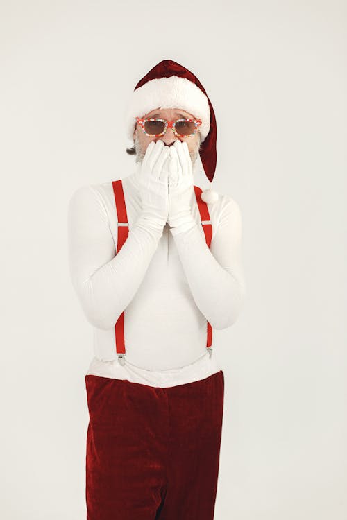 Person Wearing Red Framed Sunglasses  and Santa Hat