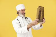A Doctor Checking the Radiograph