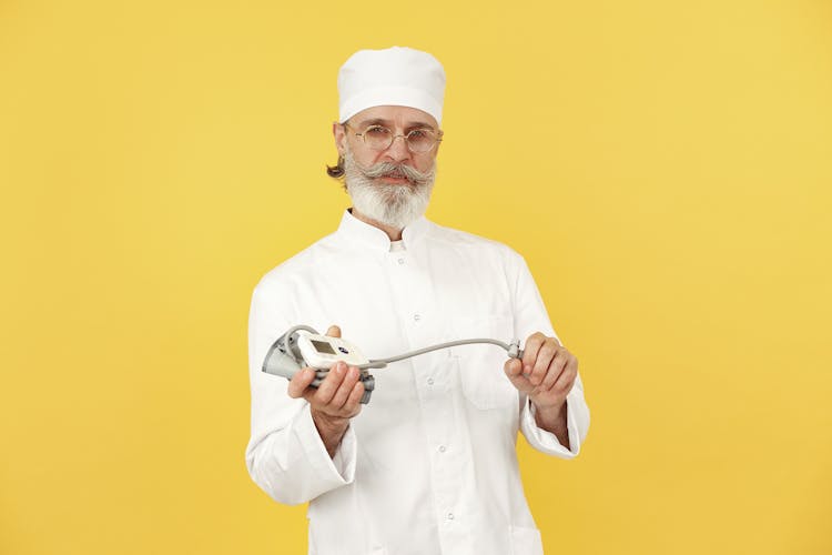 Baker In White Hat On Yellow Background