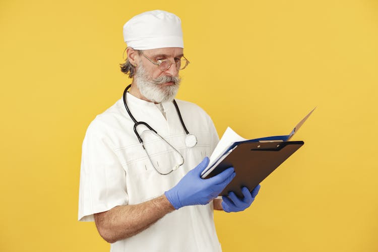 A Doctor Looking At Documents 