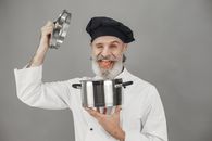 Man in White Chef Suit Holding Stainless Steel Cup