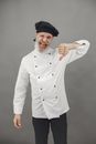 Man in White Dress Shirt and Black Cap