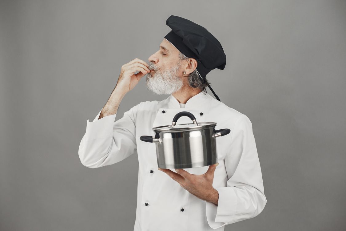 Chef Using Pot A Chef Holding a Cooking Pot · Free Stock Photo